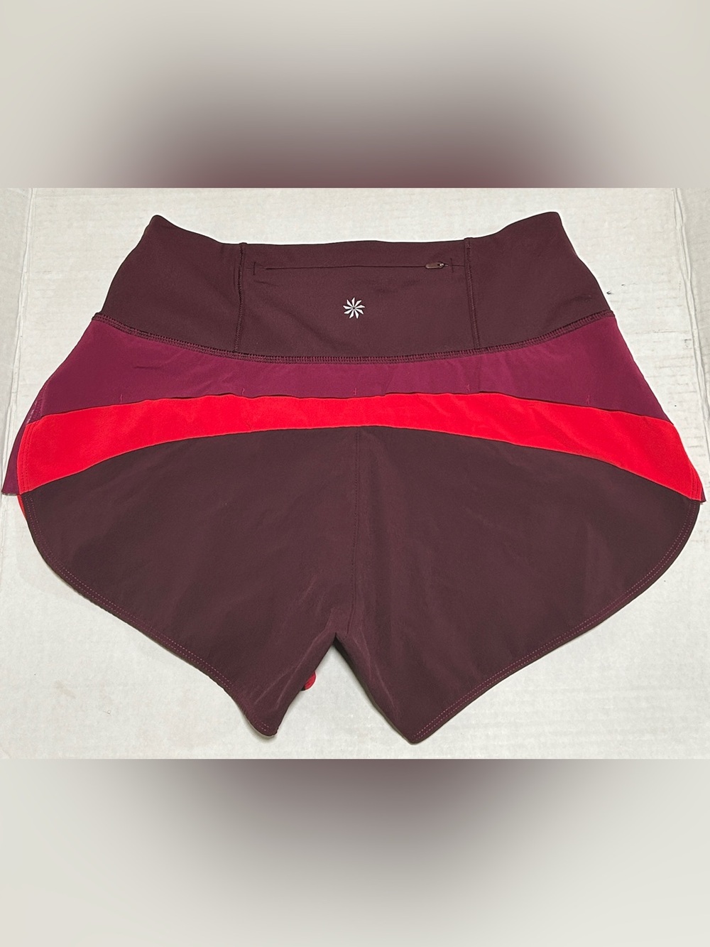 Athleta Burgundy Athletic Shorts with Magenta Panels and Red Trim